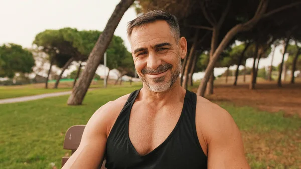 Middle Aged Muscular Man Sportswear Looks Camera Smiles While Sitting — Stock Photo, Image