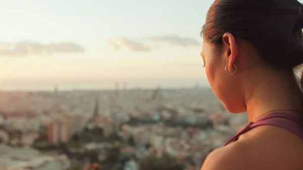 stock image Close-up of girl meditating while sitting on viewing platform at dawn