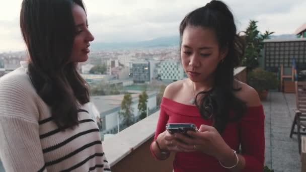 Girls Chatting Using Mobile Phone While Standing Balcony Modern City — Stock Video