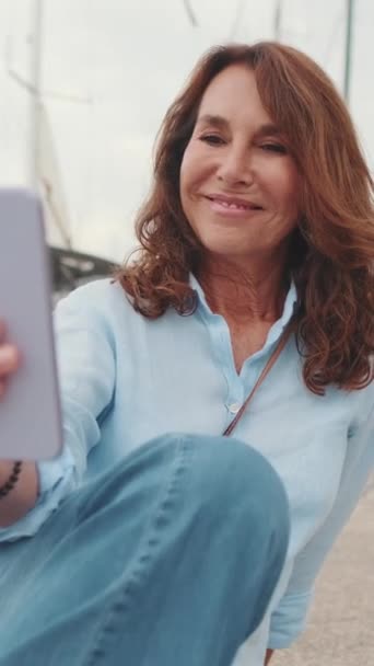 Lovely Middle Aged Woman Sits Port Takes Selfie Mobile Phone — Stock Video