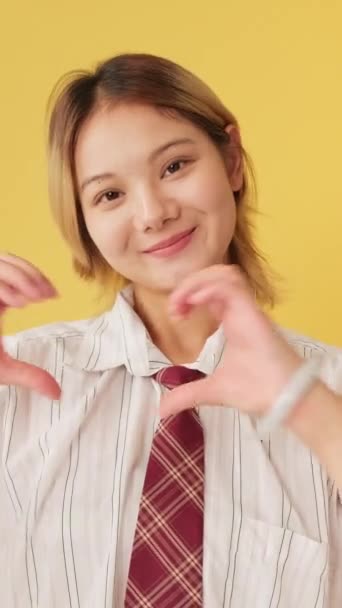 Young Woman Showing Representing Heart Shape Fingers Gesture Isolated Yellow — Stock Video