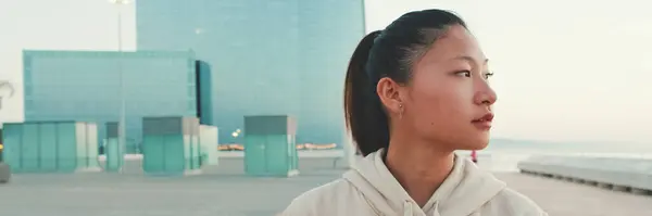 Asian girl wears sportswear walking outside at morning time, Panorama