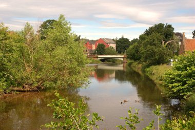 historic iron bridge on river Tyne in Haddington in summer