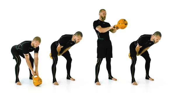 Fit middle-aged kettlebell coach demonstrating the russian kettlebell swing with double arm