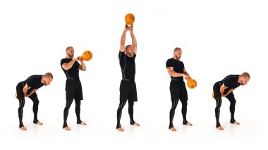 A kettlebell trainer demonstrating the American kettlebell swing with a yellow kettlebell isolated on a white background