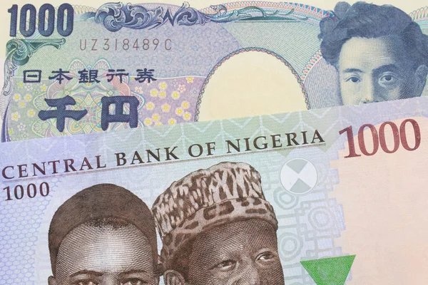 Makroobraz Niebieskiego Fioletowego Zielonego Banknotu Tysiąca Naira Nigerii Połączony Japońskim — Zdjęcie stockowe