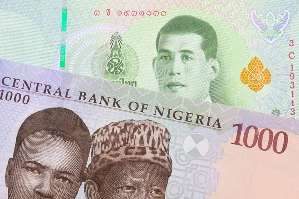 ナイジェリアの青 緑の1 000ナイラ紙幣とタイの緑の20バーツ紙幣というマクロなイメージ マクロでショットを閉じる — ストック写真