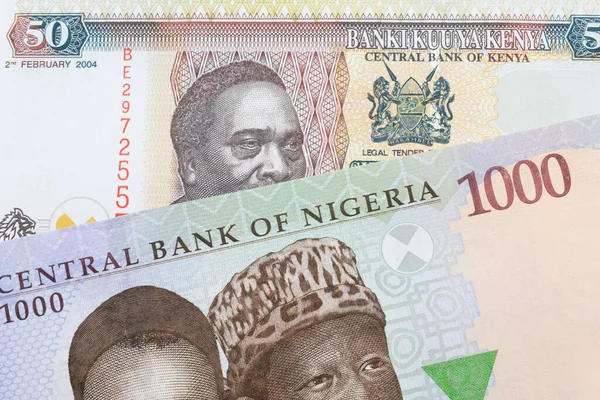ナイジェリアの青 緑の1 000ナイラ紙幣のマクロなイメージとケニアのカラフルな50シリング紙幣の組み合わせ マクロでショットを閉じる — ストック写真