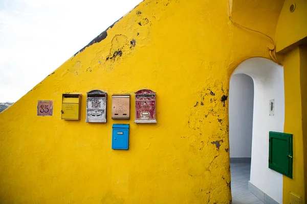 Letter Boxes Yellow Wall — Stock Photo, Image