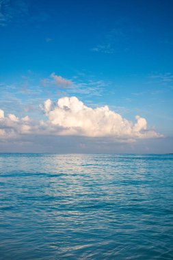 background of turquoise sea and blue sky