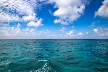 background of turquoise sea and blue sky