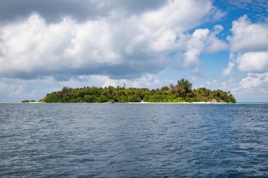 green tropical island in the sea