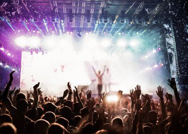 crowd partying stage lights live concert summer music festival
