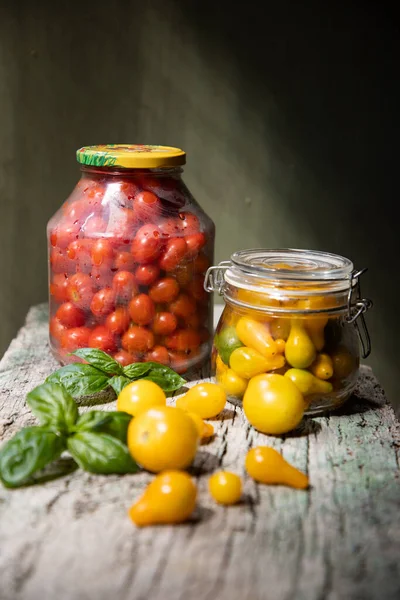 red and yellow cherry tomatoes in a jar for winter
