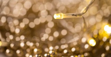 Altın bokeh Noel ışıkları arka planı