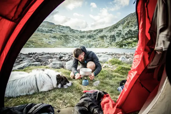 camping with dog red tent