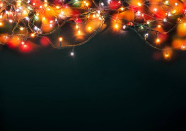 mavi arka plan üzerinde renkli Noel ışıkları