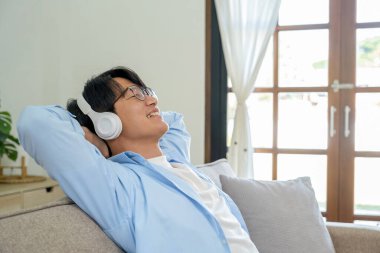 Happy cheerful businessman in home office.