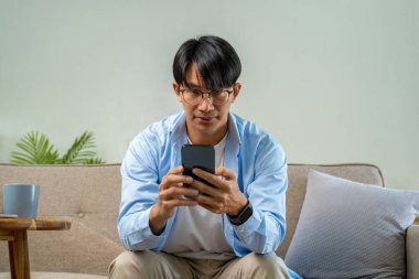 Happy cheerful businessman in home office.