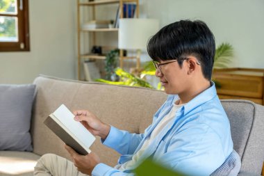 Happy cheerful businessman in home office.