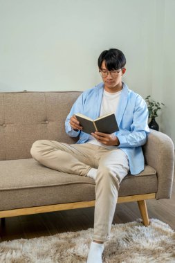 Happy cheerful businessman in home office.