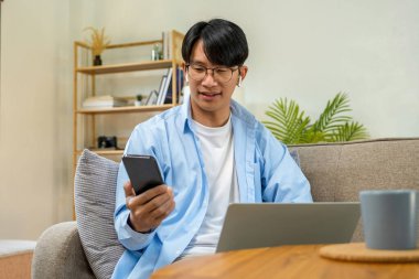 Happy cheerful businessman in home office.