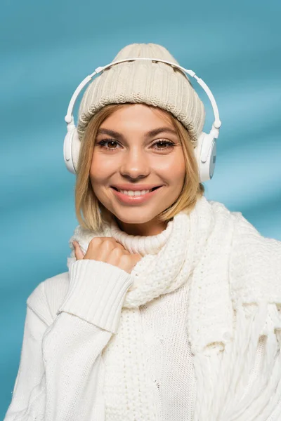Happy Young Woman Knitted Hat Wireless Headphones Looking Camera Blue — Stock Photo, Image