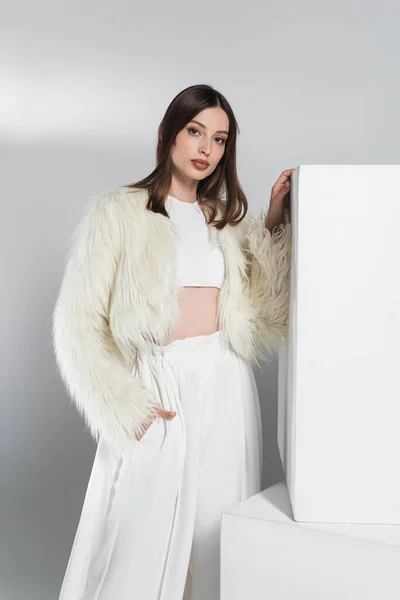 Young Woman White Faux Fur Jacket Posing Hand Pocket Cubes — Stock Photo, Image