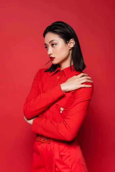 Fashionable Asian Woman Jacket Posing Hand Shoulder Looking Away Isolated — Stock Photo, Image