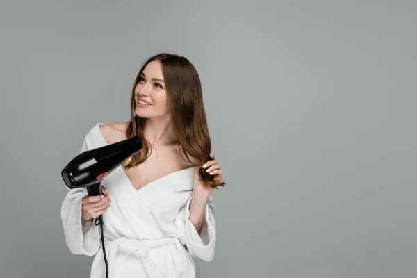 Cheerful Young Woman Shiny Hair Using Hair Dryer Isolated Grey — Stock Photo, Image
