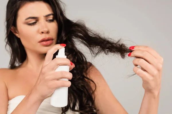 Brunette Woman Spraying Treatment Product Damaged Hair Isolated Grey — Foto de Stock