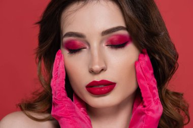 portrait of brunette woman with magenta color makeup and closed eyes isolated on pink  clipart