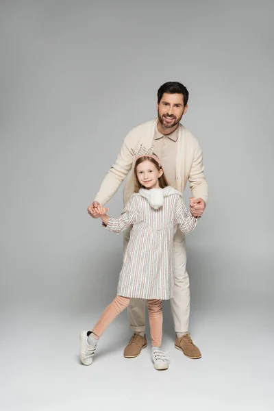 Full Length Smiling Man White Outfit Holding Hands Happy Daughter —  Fotos de Stock