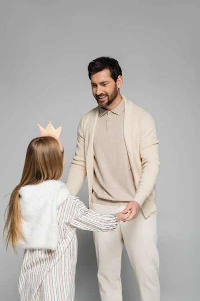 Happy Bearded Man Looking Daughter Crown While Holding Hands Grey —  Fotos de Stock