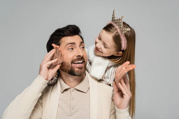 stock image happy kid in crown hugging smiling father with beard isolated on grey 