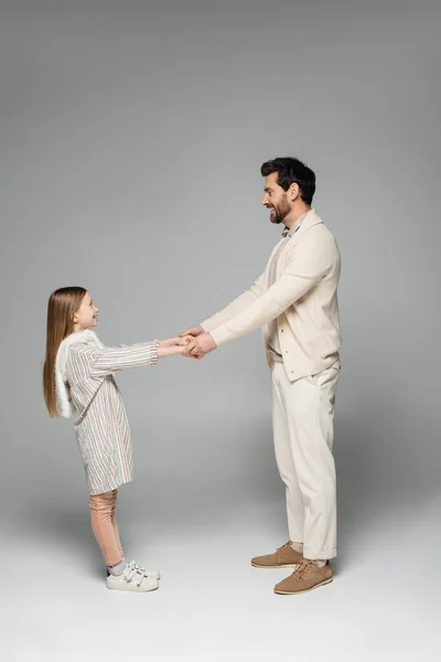 Side View Happy Father Daughter Holding Hands While Looking Each —  Fotos de Stock