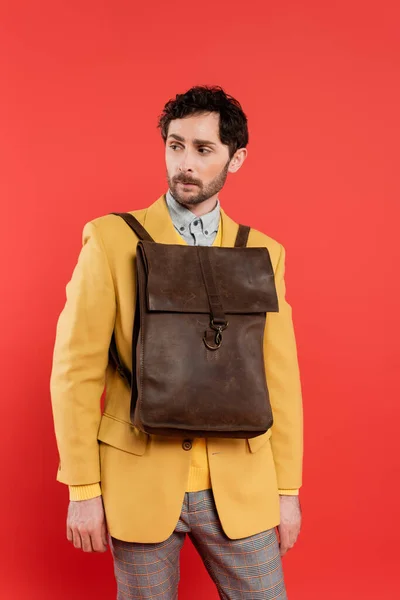 Charming Brunette Guy Backpack Blazer Standing Looking Away Isolated Coral — Stock Photo, Image