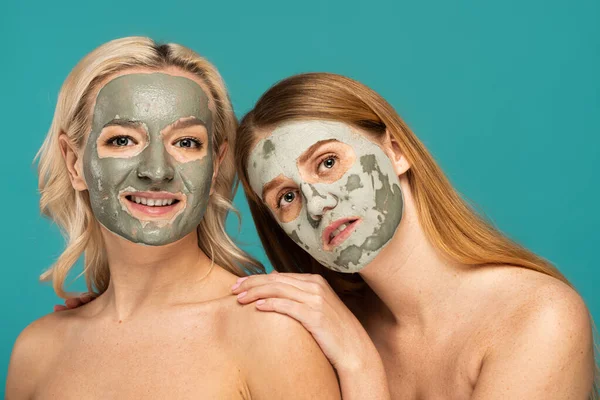 Blonde Redhead Models Clay Mask Faces Looking Camera Isolated Turquoise — Stock Photo, Image