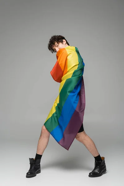 Full Length Nonbinary Person Black Boots Wrapping Himself Lgbt Flag — Stock Photo, Image