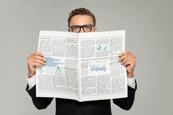 Businessman Glasses Looking Camera While Covering Face Newspaper Isolated Grey — Stock Photo, Image