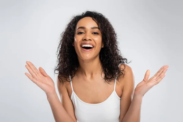 Impressed African American Woman Wavy Brunette Hair Showing Wow Gesture — Stock Photo, Image