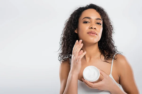 Charming African American Woman Applying Face Cream While Looking Camera — Stock Photo, Image
