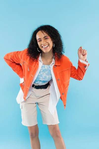 Excited African American Woman Shorts Jacket Smiling Camera Isolated Blue — Stock Photo, Image