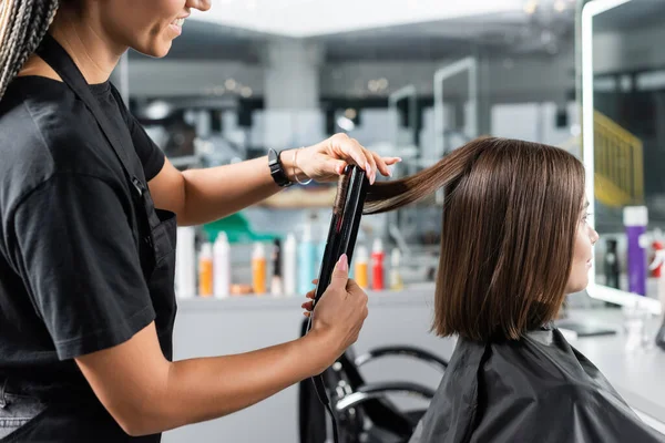 Hair Ironing Cheerful Hairdresser Hair Straightener Styling Hair Female Customer — Stock Photo, Image