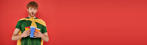 coffee addict, redhead and curly man holding paper cups with hot beverages, takeaway drink, energy and coffee, ginger, hipster, urban style, fashionable and trendy, lifestyle, banner