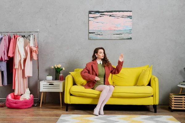 concept photography, woman acting like a doll and sitting on yellow couch, gesturing unnaturally in modern living room, well dressed and beautiful, modern house interior, role play, doll life