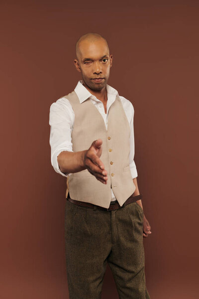 inclusion, myasthenia gravis syndrome, bold african american man offering hand for handshake, welcoming, looking at camera, dark skinned, real people, neurological disorder, physical impairment 