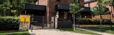 contemporary city cottage, brick walls, metal gates, real estate market, banner clipart