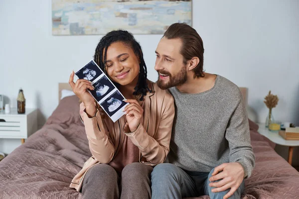 Happy Interracial Husband Wife Future Parents Pregnant Woman Holding Ultrasound — Stock Photo, Image