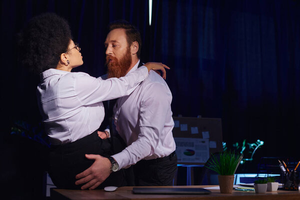 bearded businessman embracing hot african american woman sitting on desk, seduction in night office